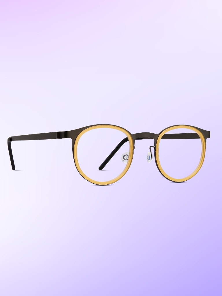 Round eyeglasses with black arms and a yellow frame front, displayed on a gradient purple background.